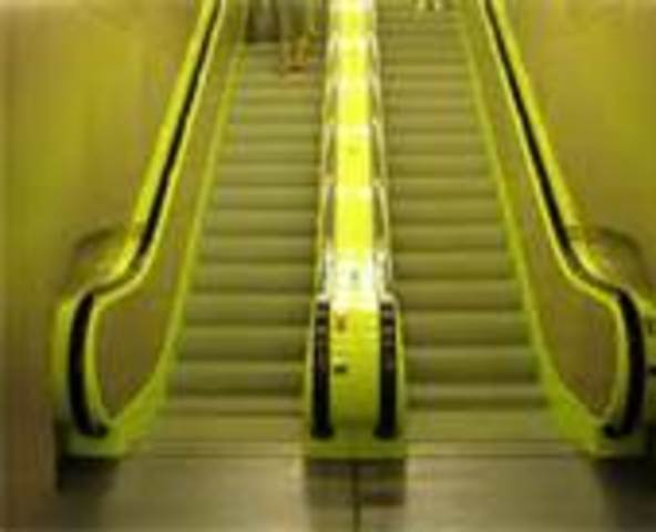 Otis engineers, led by David Lindquist, add improvements resulting in today's escalator