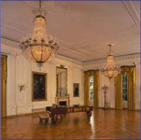 The East Room is stripped of its 1873 decor and emerges in a classic style with white walls and parquet floors