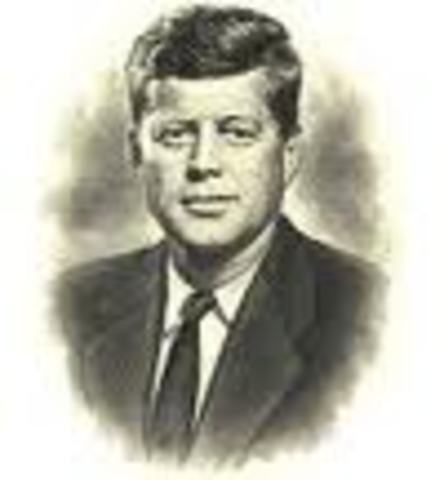 President John Kennedy approves new amendments, which in part allow male workers to choose reduced retirement benefits at 62.