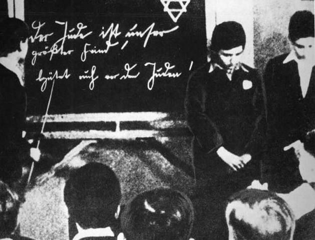 The law against "overcrowding in German schools and universities" is adopted, restricting the number of Jewish children allowed to attend. Children of war veterans and those with one non-Jewish parent are initially exempted.