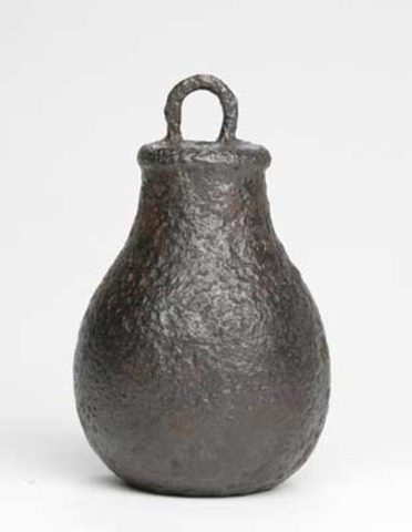 She gets hit in the head with an iron weight.