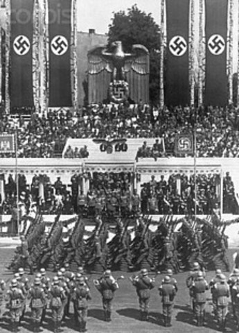 Hitler's army invades the Rhineland.