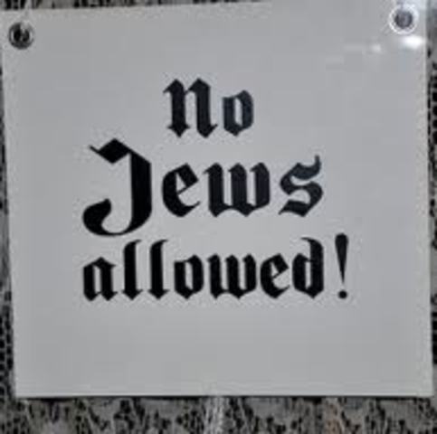 Jews are barred from government service; Jewish civil servants, including University professors and school teachers, are fired from their positions.