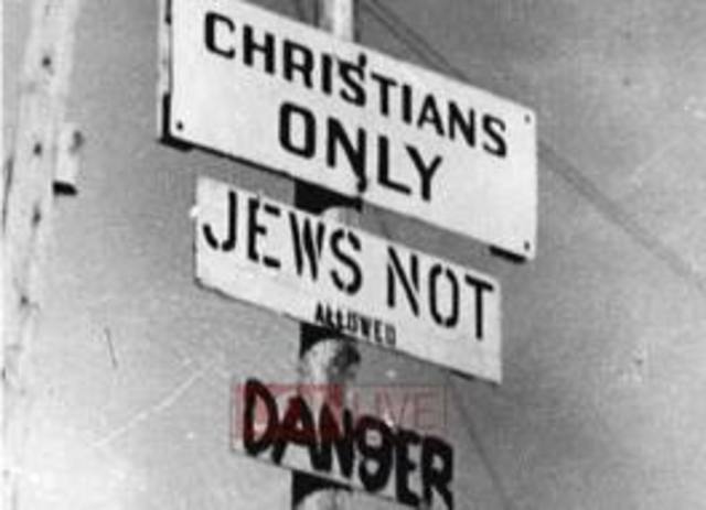 "No Jews" signs and notices are posted outside German towns and villages, and outside shops and restaurants.