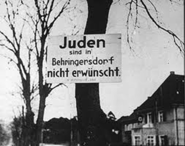 "No Jews" signs and notices are posted outside German towns and villages, and outside shops and restaurants.