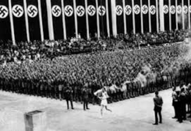The Olympic Games take place in Berlin. Anti-Jewish signs (i.e., "Jews Not Welcome") are removed until the Games are completed.