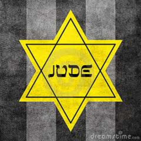 Germans force Jews in Poland to wear a yellow Star of David on their chests or a blue-and-white Star of David armband.