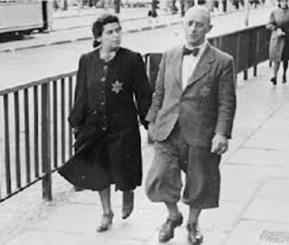 The German government announces Jews must carry identification cards.