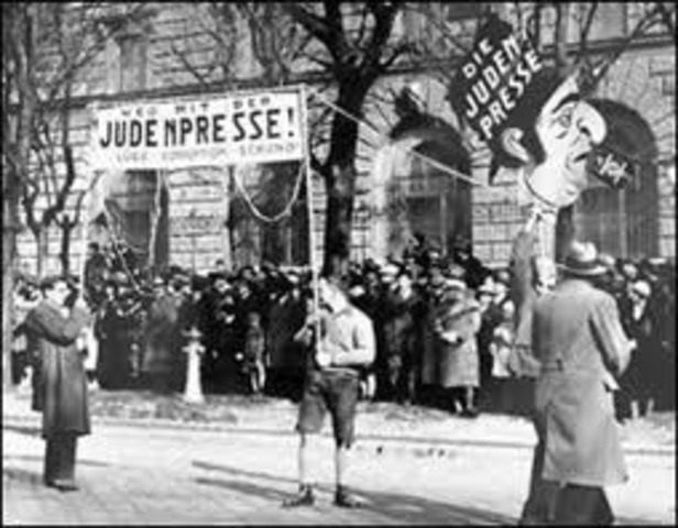 Jews must sell their businesses and real estate and hand over their securities and jewelry to the government at artificially low prices.