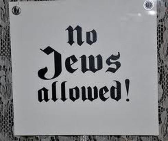 "No Jews" signs and notices are posted outside German towns and villages, and outside shops and restaurants.