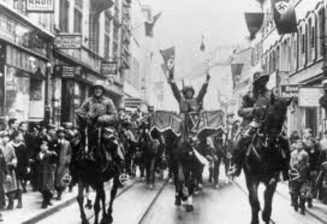 Hitler's army invades the Rhineland.