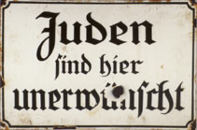 "No Jews" signs and notices are posted outside German towns and villages, and outside shops and restaurants.