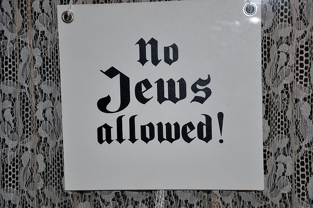 "No Jews" signs and notices are posted outside German towns and villages, and outside shops and restaurants.