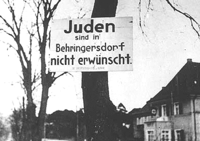 "No Jews" signs and notices are posted outside German towns and villages, and outside shops and restaurants