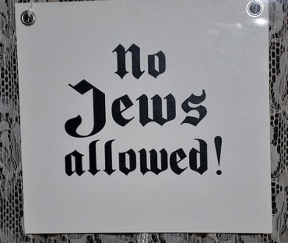 "No Jews" signs and notices are posted outside German towns and villages, and outside shops and restaurants.