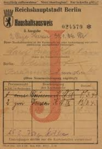 The German government announces Jews must carry identification cards.