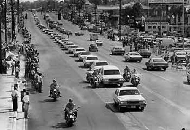 Elvis is found dead in his bathroom by ginger due to drug over dose and is buried next to his mother in Graceland.