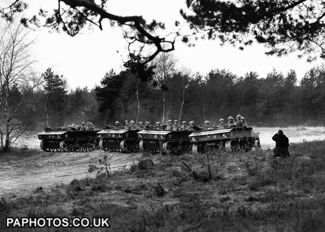 The United States will begin emerging from the Depression as it borrows and spends $1 billion to build its armed forces.