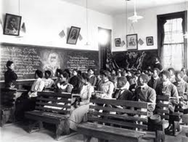 Massachusetts passes a law making all grades of public school free of charge.