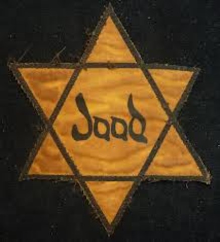 Yellow stars required to be worn by Polish Jews over age 10.