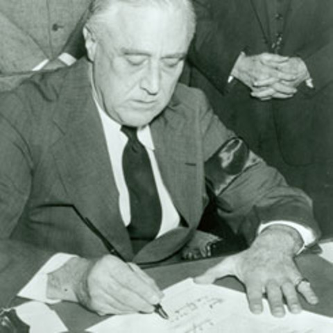 FDR signs the Lend Lease Act