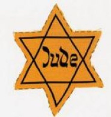 German Jews above the age of six are forced to wear a yellow Star of David sewed on the left side of their clothes with the word "Jude" printed in black.