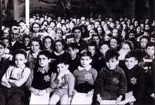 German Jews above the age of six are forced to wear a yellow Star of David sewed on the left side of their clothes with the word "Jude" printed in black.