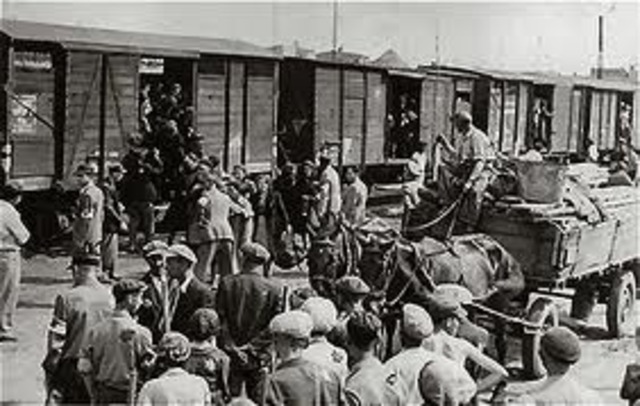 Jews in the Lódz ghetto are deported to the killing center at Chelmno.