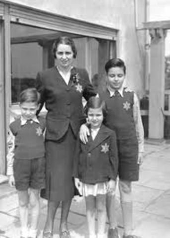 Germans force Jews in Poland to wear a yellow Star of David on their chests or a blue-and-white Star of David armband.