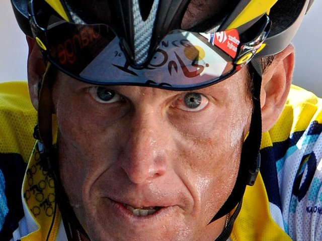 American cyclist Lance Armstrong wins his record 7th straight Tour de France.