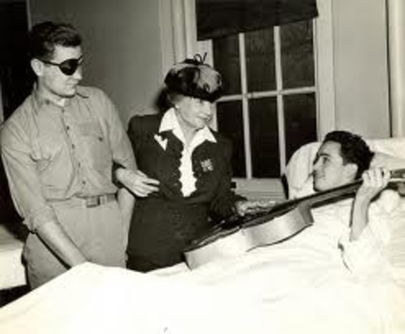 Helen visits the handicapped people from the World War