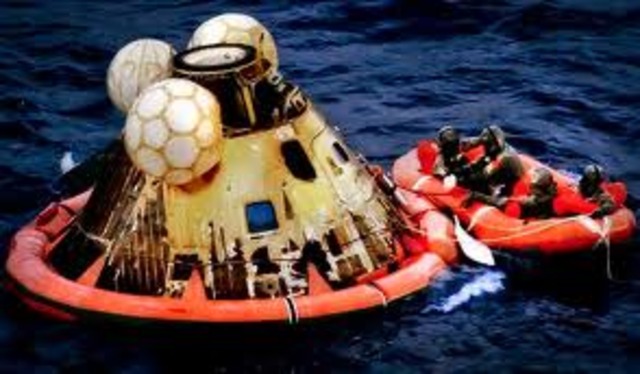 apollo 11 crew return to earth and thier mission is officialy successful
