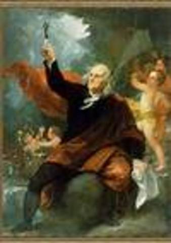 Benjamin Franklin flies a kite