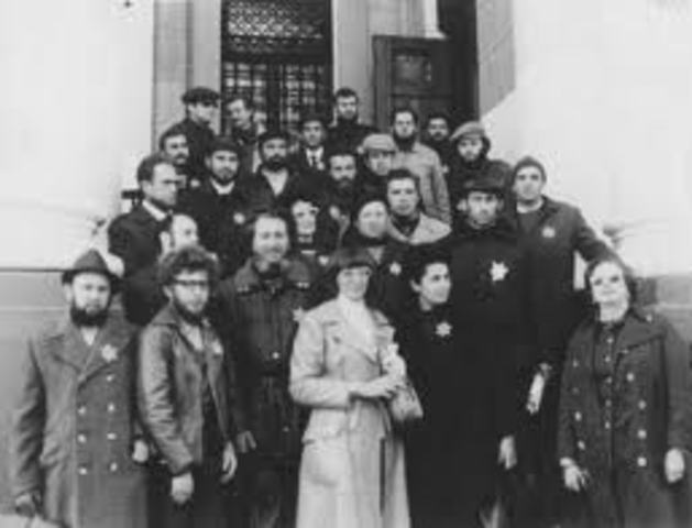 Jews in France and the Netherlands are required to wear identifying Stars of David.