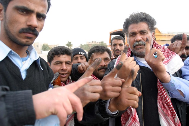 Millions of Iraqi voters ratify a new constitution