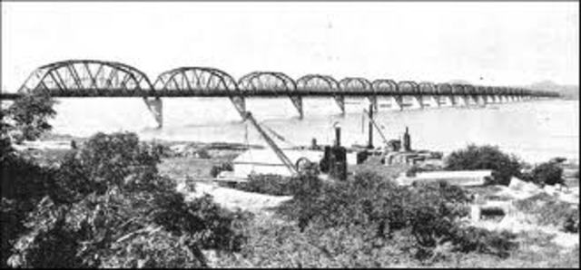 World's longest railroad bridge, over lower Zambesi River in South Africa, is completed.