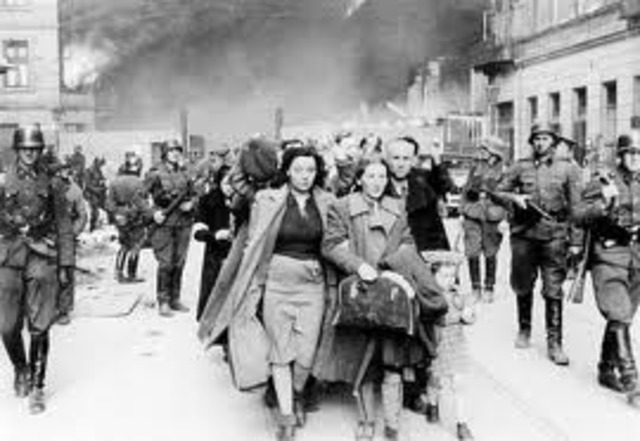 Jews in the Warsaw ghetto initiate resistance to deportation by the Germans to