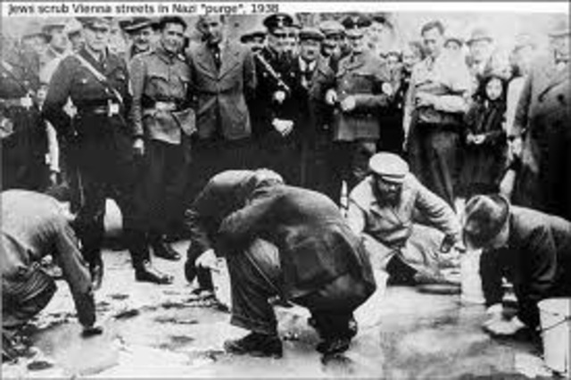 Jews must sell their businesses and real estate and hand over their securities and jewelry to the government at artificially low prices.