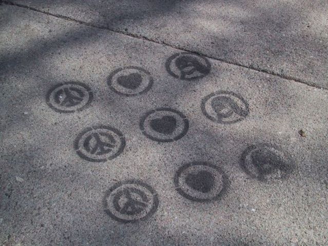 IBM gets into trouble over its “Peace, Love and Linux” graffiti in several cities.