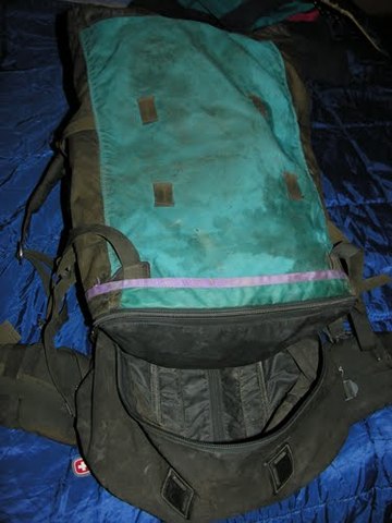 Chris buries his backpack