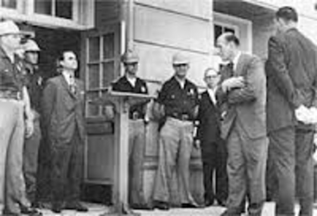 George Wallace stands in door