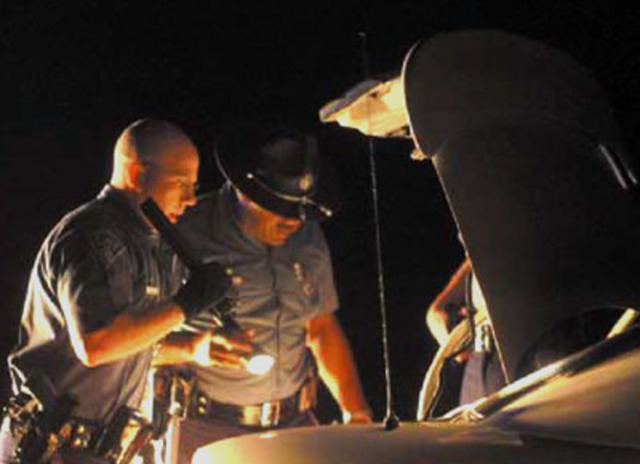 The Chamberlain car is seached by police.