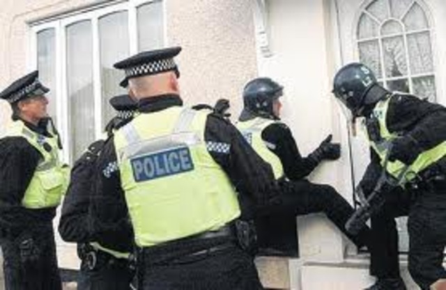 Police raid homes