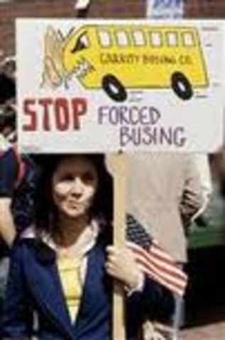 Forced busing begins