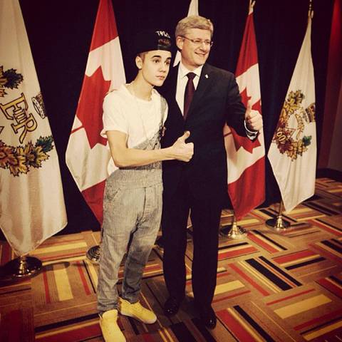 Wears overalls to meet Canadian PM