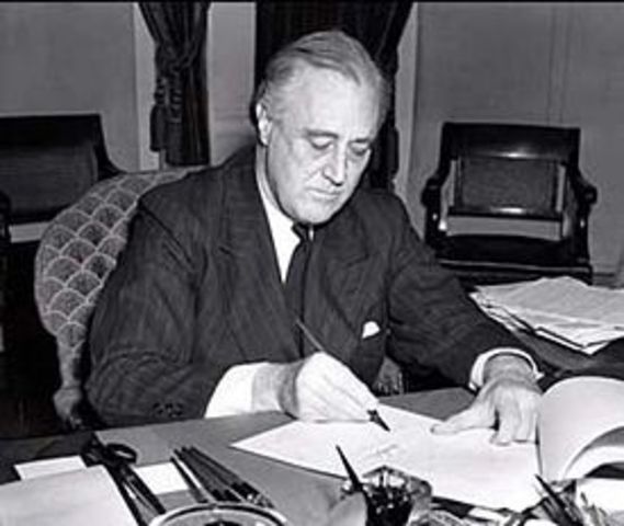 FDR signs the "Lend-Lease" act