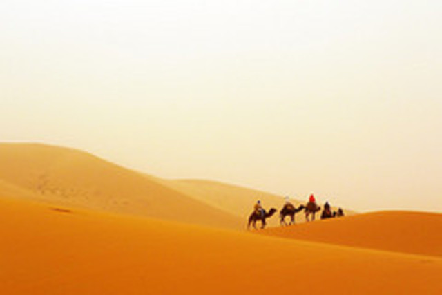 Santiago meets the leader of the caravan