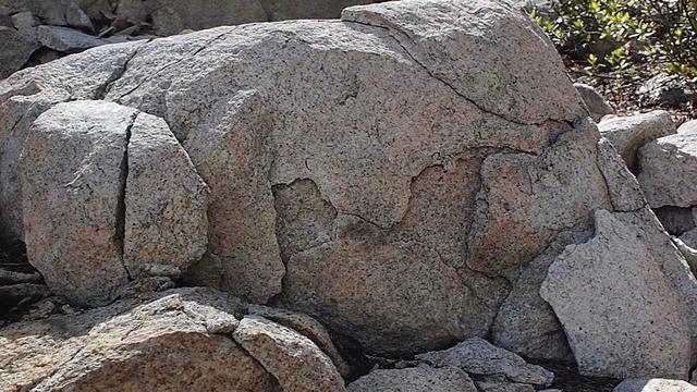 Charles Hollis hews granite from boulders in town and hauls them to boston