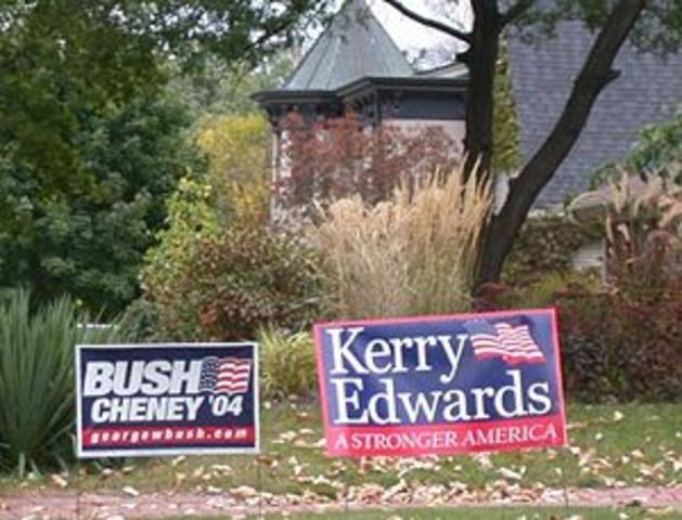 Election signs next to each other in 2004, the right of the sign of John Kerry and John Edwards, and left that of George W. Bush and Dick Cheney