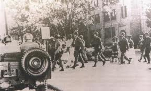 Eisenhower orders federal troops to desegregate Little Rock High School; Soviets launch Sputnik